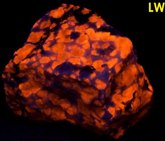 fluorescing SODALITE, AEGIRINE Acmite, FELDSPAR - Poudrette quarry (Demix quarry; Uni-Mix quarry; Desourdy quarry; Carrière Mont Saint-Hilaire; MSH), Mont Saint-Hilaire, La Vallée-du-Richelieu RCM, Montérégie, Québec, Canada