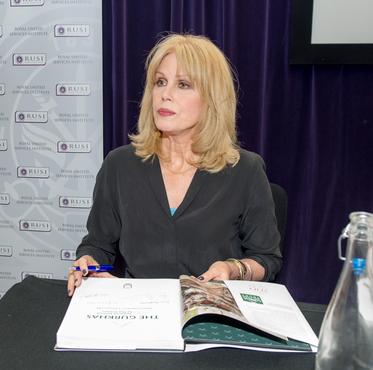 Joanna Lumley signing a copy of the Gurkha history