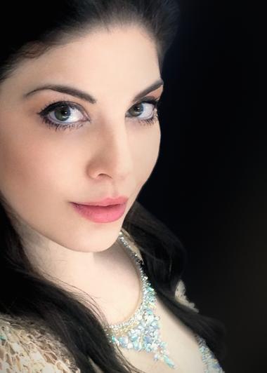 Color photo of spinto soprano Megan Marie Hart in 3-quarter portrait.