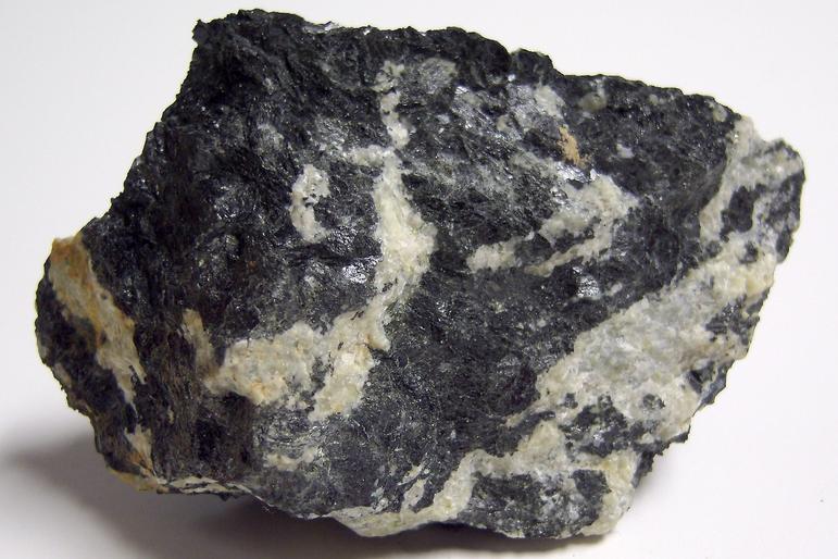MAGNESIO-HORNBLENDE and fluorescent ALBITE, Philips Mine (Philips Pyrite Mine; Anthony's Nose Pyrrhotite Mine), Anthony's Nose, Philipstown Township, Putnam County, New York, USA