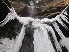 frozen waterfall on winter nature hike in hocking hills