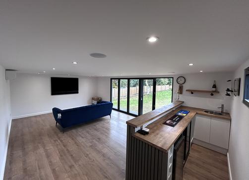 Large modern garden room with pool table and bar