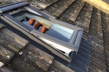 VELUX centre pivot window. PMV Maintenance - VELUX and Roto roof window / Skylight repair, replacement, installation, re-glazing, servicing, maintenance, Blinds, Leaks, repairs, Glass, renovation specialists covering London, Hertfordshire, Bedfordshire, Cambridgeshire, Essex, South London, North London and Central London.