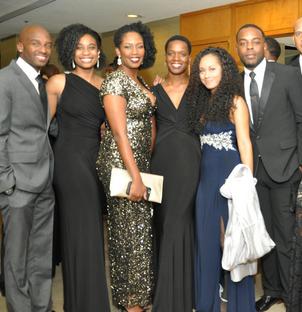 JL Turner Legal Association Foundation Gala Attendees smile at camera in formal wear