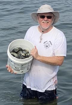 Clamming in the shallow waters off Long Island NY. www.Bluedayzgear.com