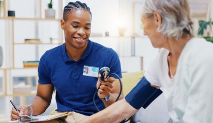 PCT assisting a patient