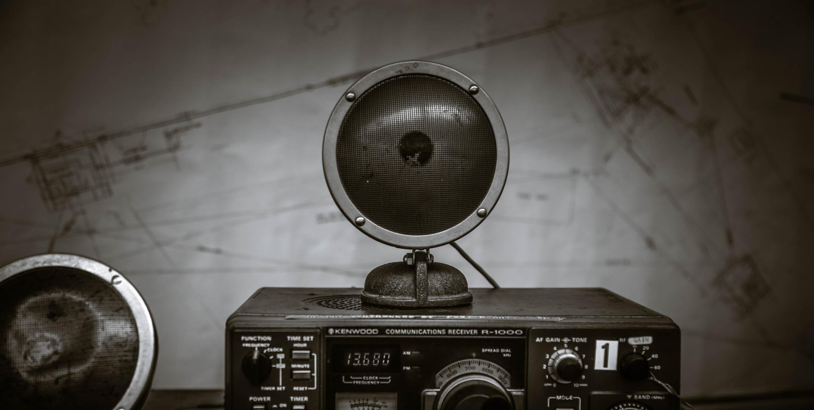 vintage two way radio with map background black and white