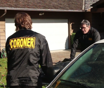 Two County Coroner men removing a body from a crime scene