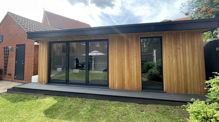 Large modern garden room with pool table and bar