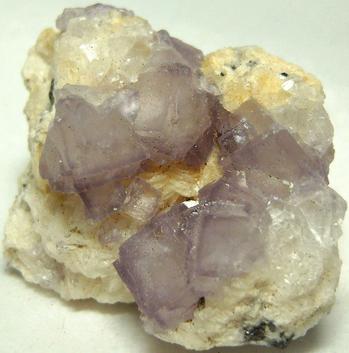 fluorescent FLUORITE on CALCITE with PYRITE, Huanzala Mine, Huallanca District, Bolognesi Province, Ancash Department, Peru