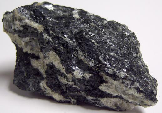 MAGNESIO-HORNBLENDE and fluorescent ALBITE, Philips Mine (Philips Pyrite Mine; Anthony's Nose Pyrrhotite Mine), Anthony's Nose, Philipstown Township, Putnam County, New York, USA