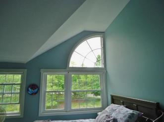 teal color painted bedroom.
