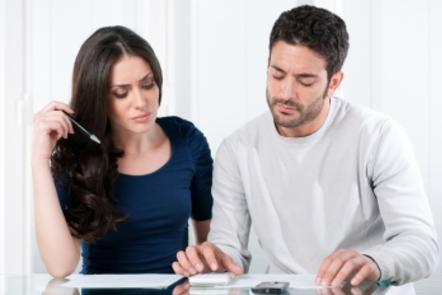 Distressed couple looking at financials