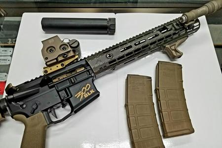 300 Blk Ar Pistol in black with bronze accents on magazines, grip, flashlight and foregrip as well as optic and base