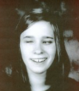 Head-shot of Samantha\, smiling at camera.