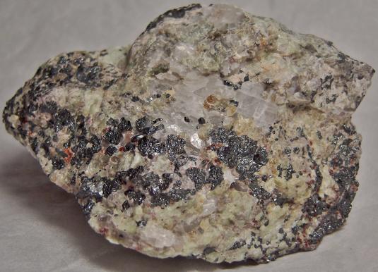 FRANKLINITE, ZINCITE, fluorescing WILLEMITE, CALCITE and HARDYSTONITE - Franklin Mine, Franklin, Franklin Mining District, Sussex County, New Jersey, USA - type locality of Franklinite, Zincite, and Hardystonite - sold