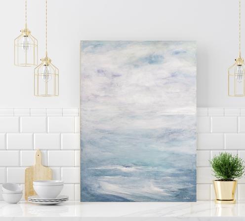 Blue Art ocean seascape in light blue and white which shows calm ocean water and clouds in the sky.
