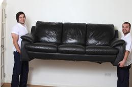 2 men removing couch