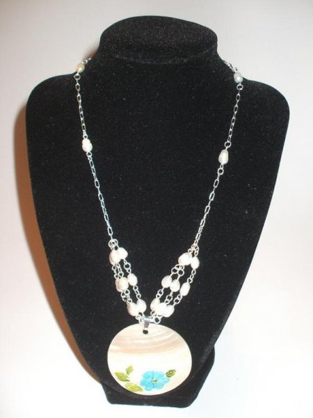 A SilvenChain with Fresh Water Beads and a Natural Shell Pendant ...