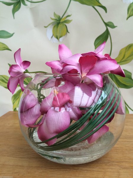 STUNNING PINK ORCHID & BEAR GRASS FLOWER ARRANGEMENT IN GLASS BOWL WITH